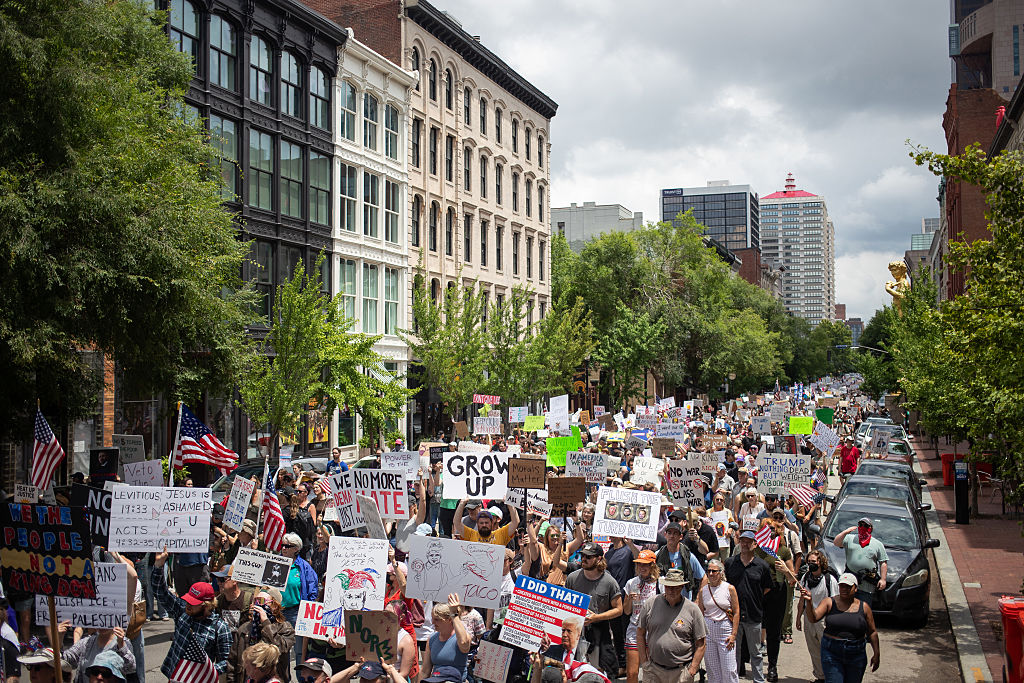 Protesters march during a nationwide "No Kings" rally in downtown Louisville, Kentucky, on June 14, 2025, on the same day as President Donald Trump's military parade in Washington, DC.