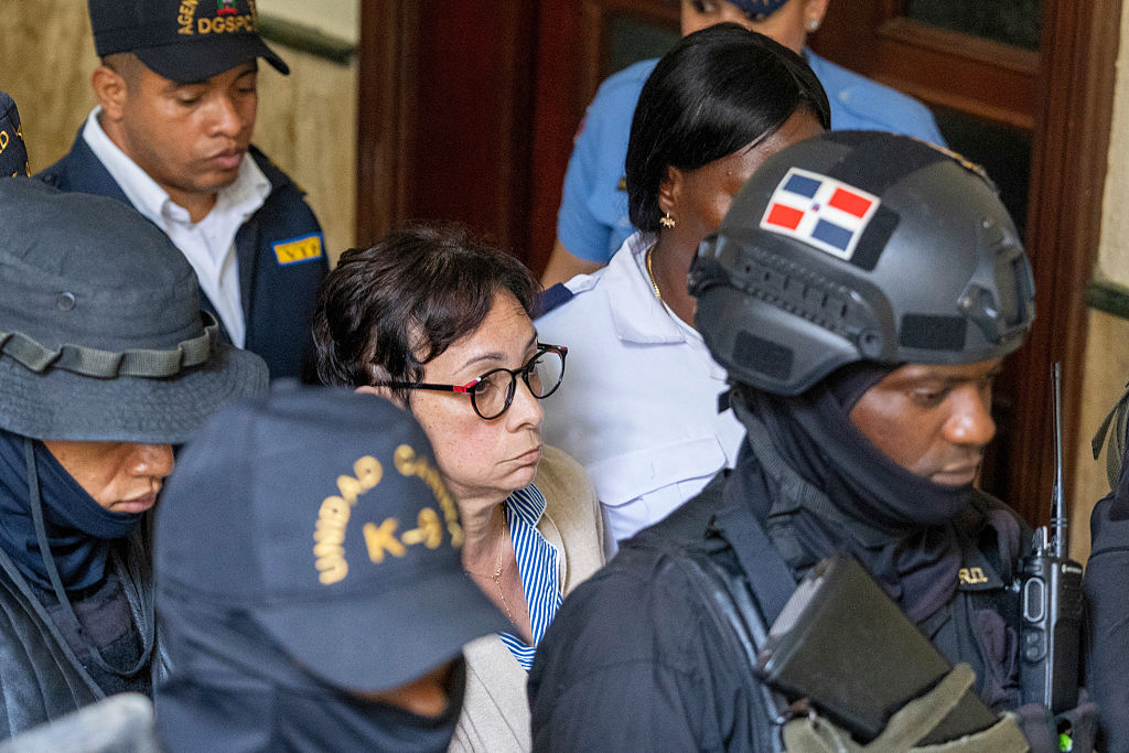 Members of special police forces take Maribel Espaillat, sister of businessman Antonio Espaillat, into custody in Santo Domingo on June 15, 2025.