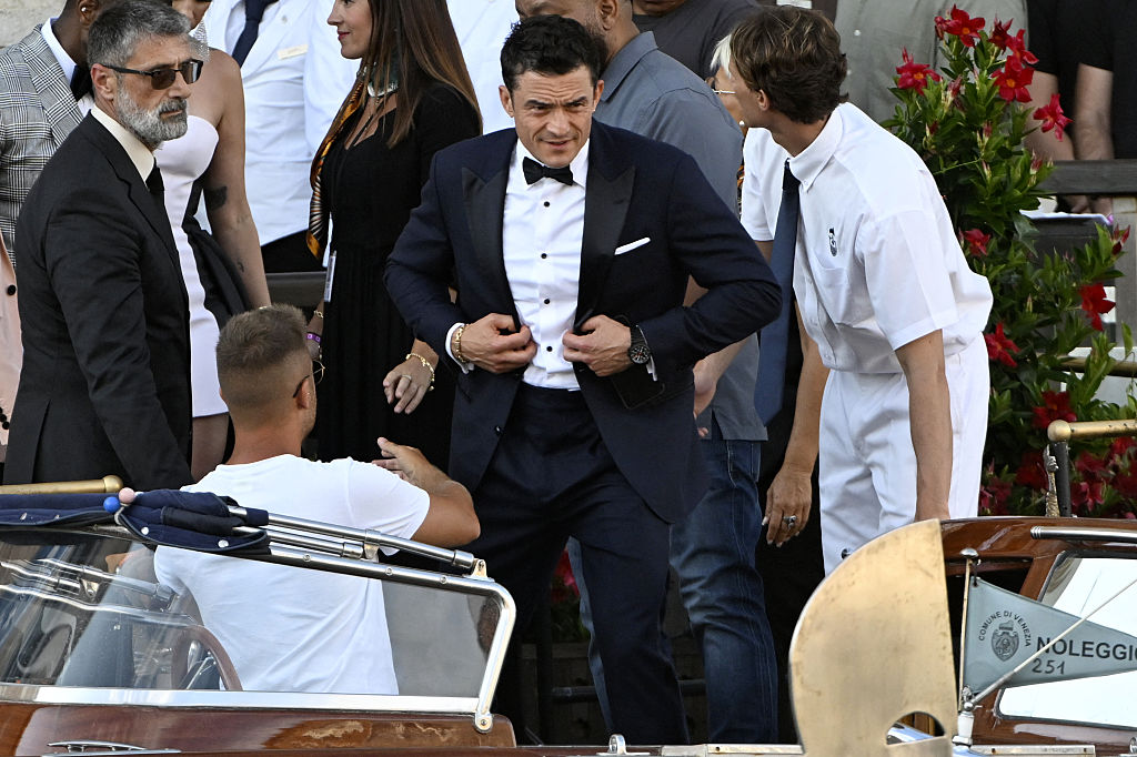 British actor Orlando Bloom leaves the Gritti Palace Hotel on the wedding day of Amazon founder Jeff Bezos with Lauren Sanchez, in Venice on June 27, 2025.