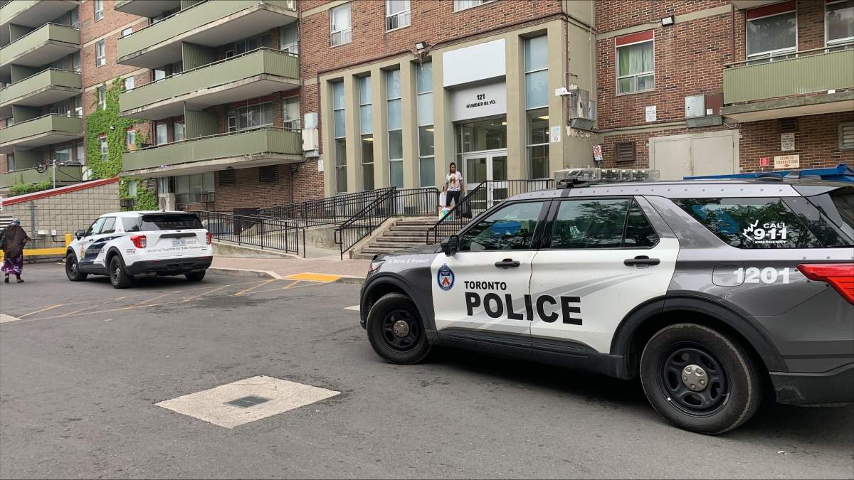 Toronto police attend the scene of a fall in Toronto on June 5, 2025.