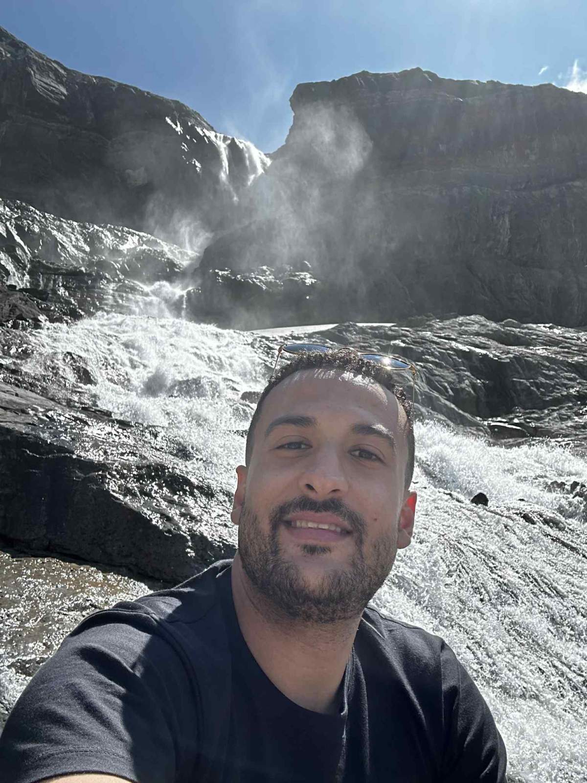33-year-old Hazma Benhilal sits on the rocks in front of Bow Glacier Falls where a short time later a large part of the mountain gave way, sending large boulders tumbling over hikers below, killing Benhilal, who was visiting from Surrey, B.C. and 70-year-old Jutta Hinrichs from Calgary.