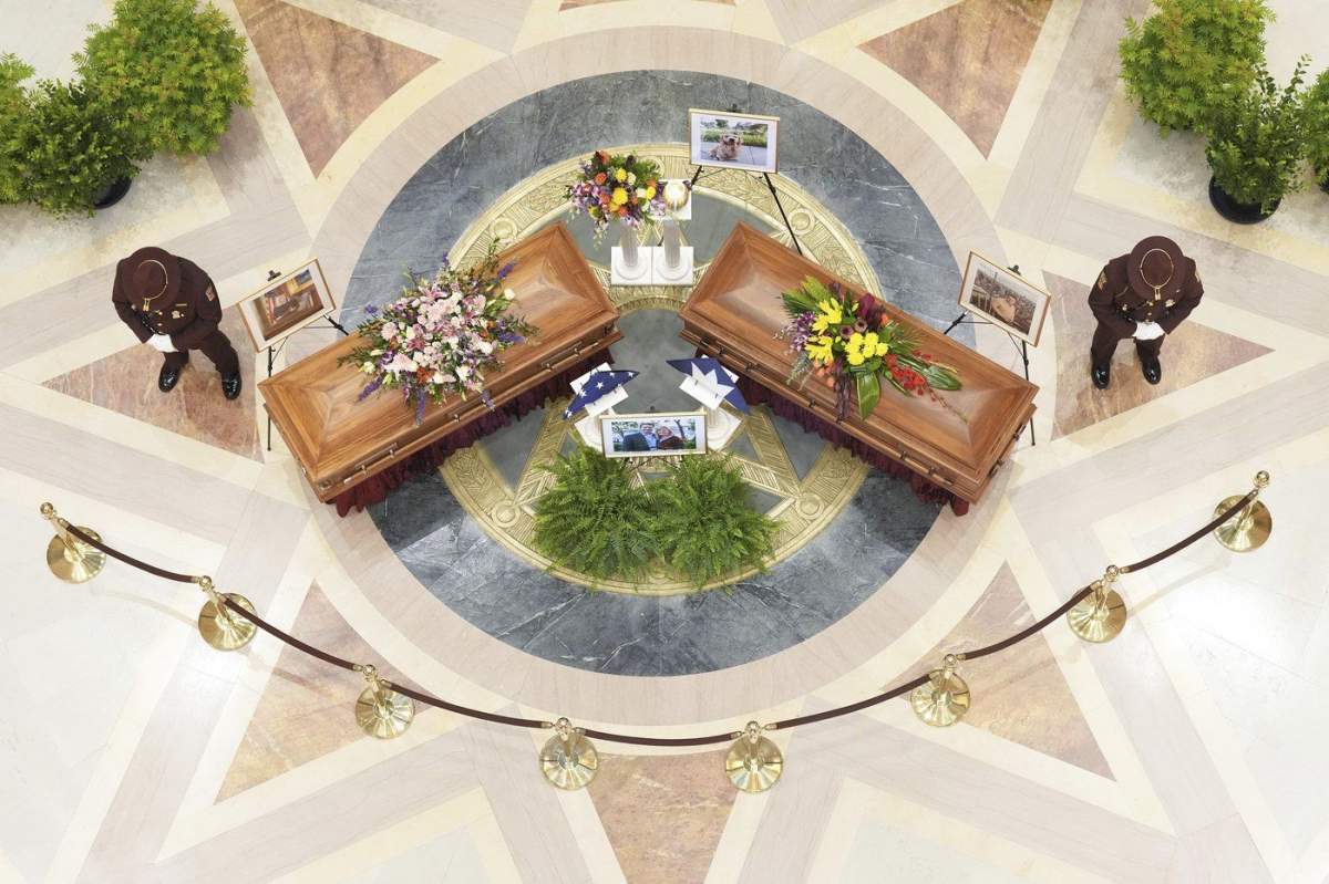 Minnesota State Representative Melissa Hortman, Mark Hortman and their dog, Gilbert, lie in state at the Minnesota State Capital in St. Paul, Minn., on Friday, June 27, 2025. (Alex Kormann/Star Tribune via AP)