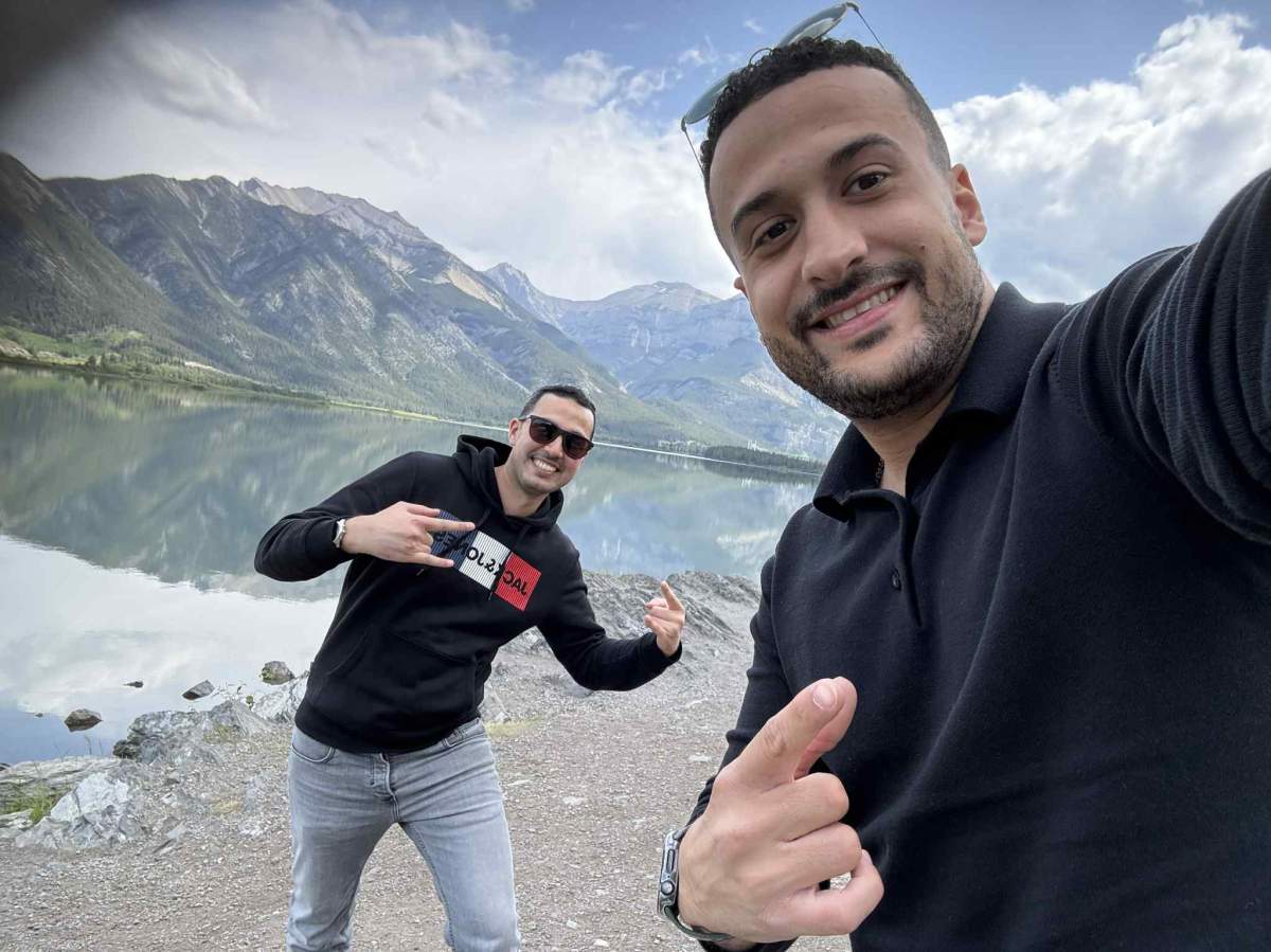 A photo of Hazma Benhilal (left) and Khaled Elgaml (right) at Bow Lake, the start of their hike into Bow Glacier Falls, on Thursday, June 19, 2025.