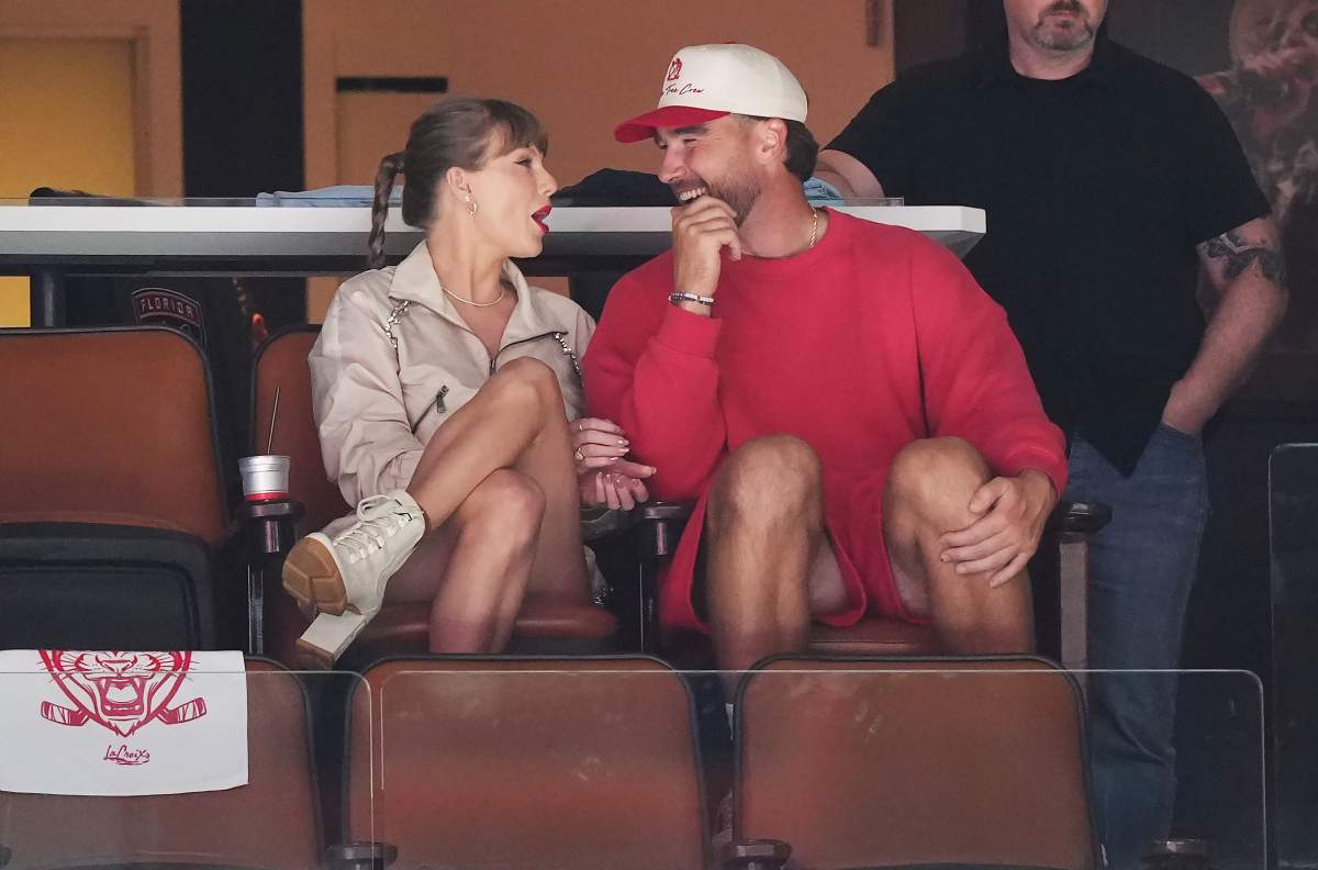 Taylor Swift and Travis Kelce take in the third period in Game 4 of the Stanley Cup final between the Edmonton Oilers and Florida Panthers in Sunrise, Fla., on Thursday, June 12, 2025.
