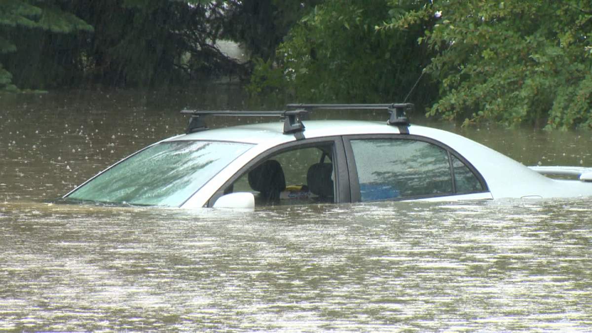 This car was submerged by the rising waters in a parking lot at Calgary's Confederation Park.