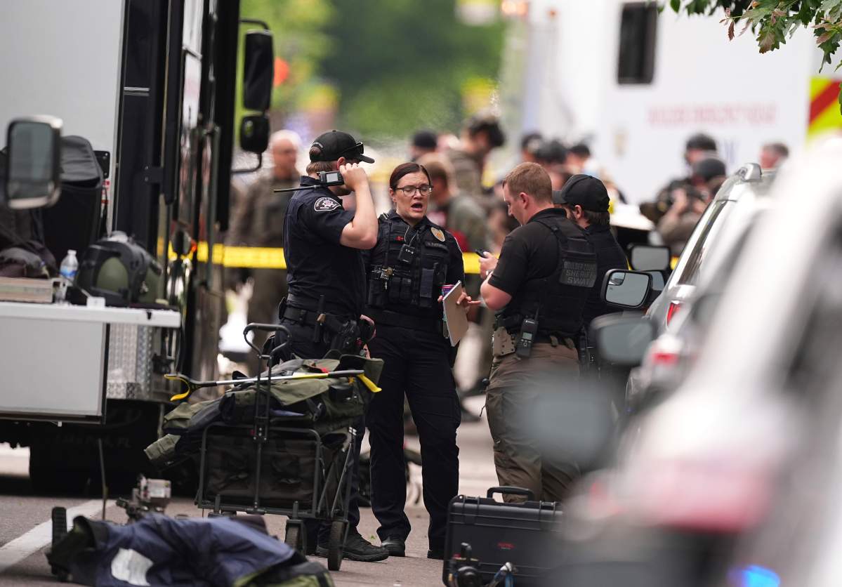 Law enforcement officials investigate after an attack on the Pearl Street Mall Sunday, June 1, 2025, in Boulder, Colo.