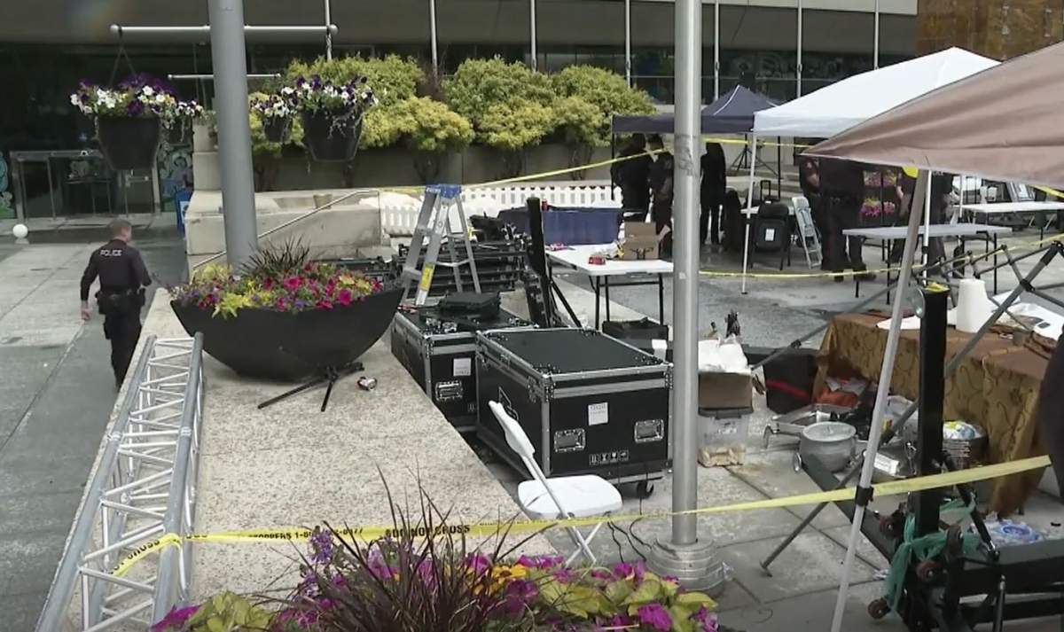 Police tape at the scene of a temporary structure collapse near Calgary City Hall on Saturday.