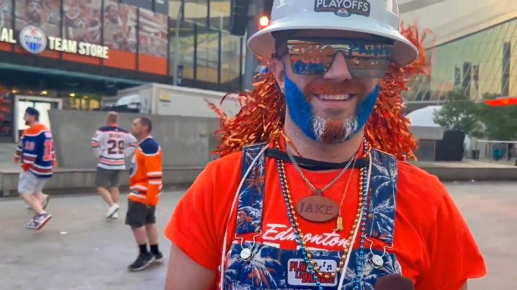 Edmonton Oilers superfan Jacob Golka, who paints fans' faces at the Moss Pit watch party outside Rogers Place in Edmonton, is seen in this image from video on Monday, June 9, 2025.