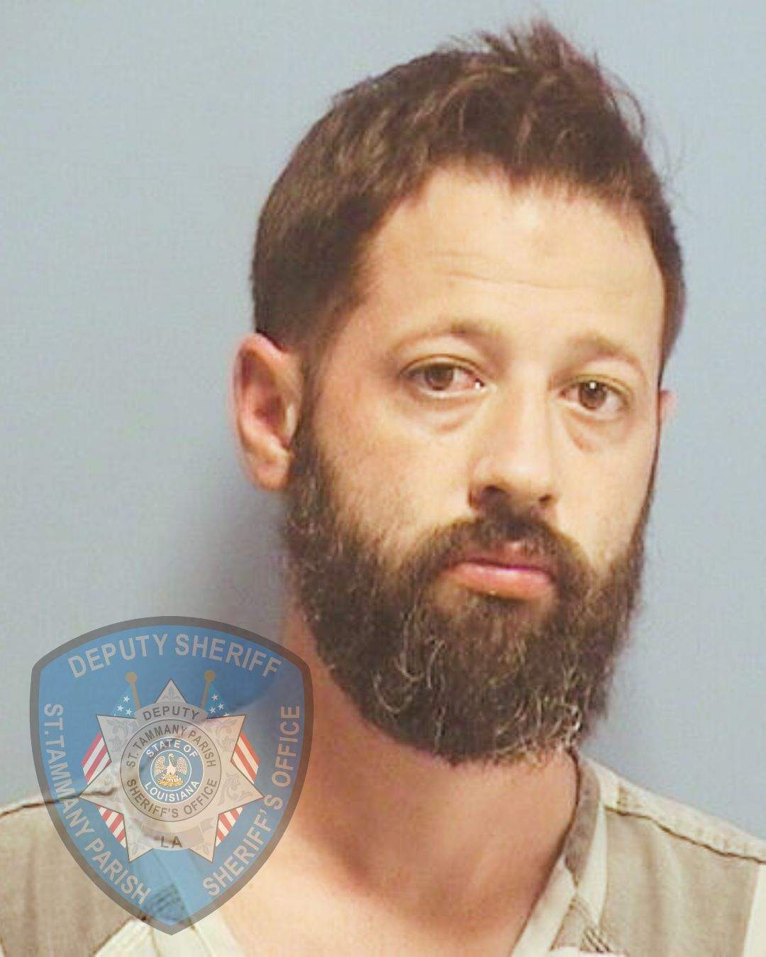 Joseph Boatman mugshot. He has a thick beard and short hair.