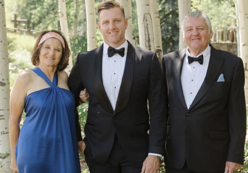 This undated photo provided by the Pickles family shows Josh Pickles, center, with his parents Terry Pickles, right, and mother Paula Bozinovich.