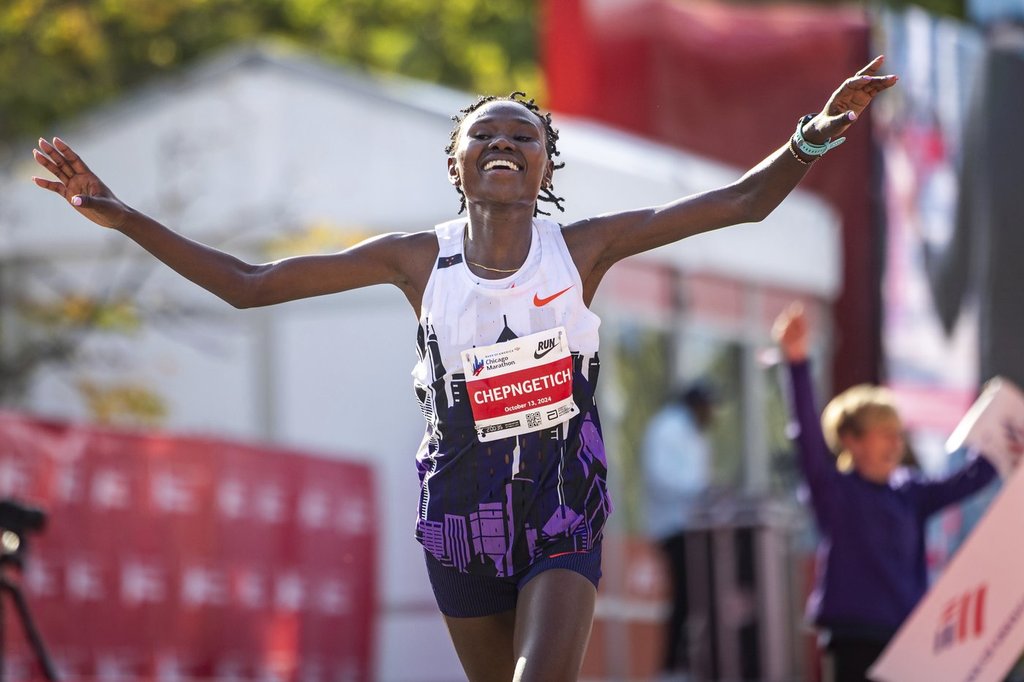 FILE – Ruth Chepngetich, from Kenya, crosses the finish line of the Chicago Marathon to win the women’s professional division and break the women’s marathon world record in Grant Park on Oct. 13, 2024. (Tess Crowley/Chicago Tribune via AP, file)