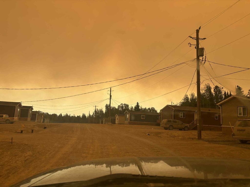 Smoke from wildfires is shown at Sandy Lake First Nation, Ont., in this Saturday, June 7, 2025, handout photo. 