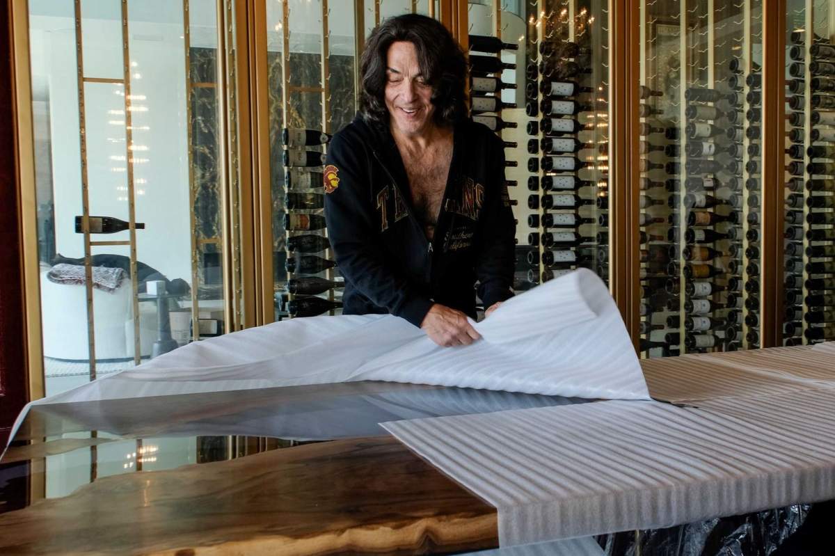 Rock-N-Roll legend Paul Stanley unwraps his new custom designed and built table after it was delivered to his home in Los Angeles.