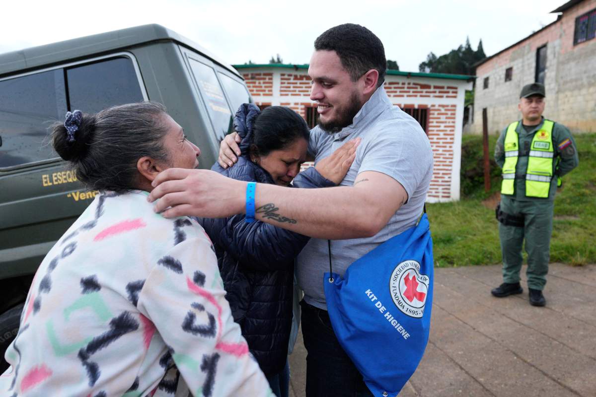 Carlos Uzcátegui, one of the Venezuelan migrants deported months ago to El Salvador by the United States under an immigration crackdown, is embraced by his mother, Lisa Uzcátegui, upon arriving home in Lobatera, Venezuela, Wednesday, July 23, 2025.