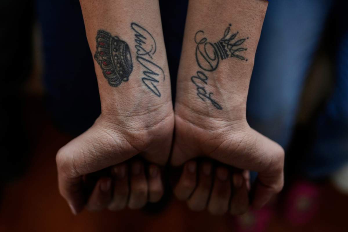 Andry Hernandez Romero, a Venezuelan migrant deported months ago to El Salvador by the United States under an immigration crackdown, shows tattoos on his wrists that read "mom" and "dad" after arriving home in Capacho Nuevo, Venezuela, Wednesday, July 23, 2025.