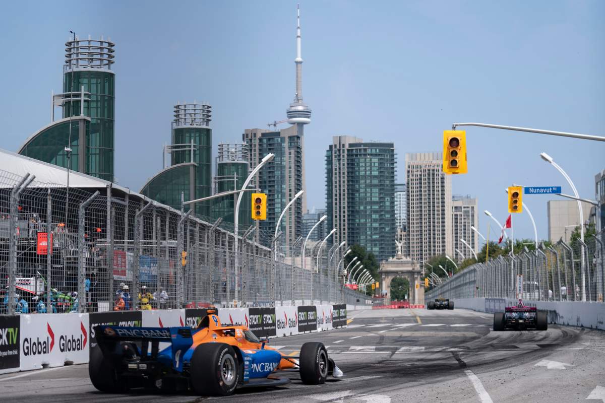 Third place finisher Scott Dixon (9) of New Zealand, left, trails second place finisher Kyle Kirkwood (27) of the United States and winner Colton Herta (26) of the United States during the 2024 Ontario Honda Dealers Indy, in Toronto on Sunday, July 21, 2024. THE CANADIAN PRESS/Arlyn McAdorey