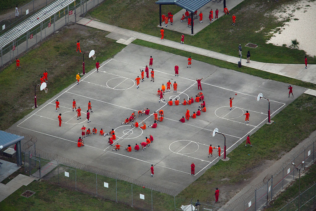 In an aerial view from a helicopter, detainees are seen at Krome Detention Center run by United States Immigration and Customs Enforcement on July 4, 2025 in Miami, Florida. U.S. President Donald Trump was present at the opening of the nearby "Alligator Alcatraz", a 5,000-bed facility, located at an abandoned airfield in the Everglades wetlands, part of his expansion of undocumented migrant deportations.