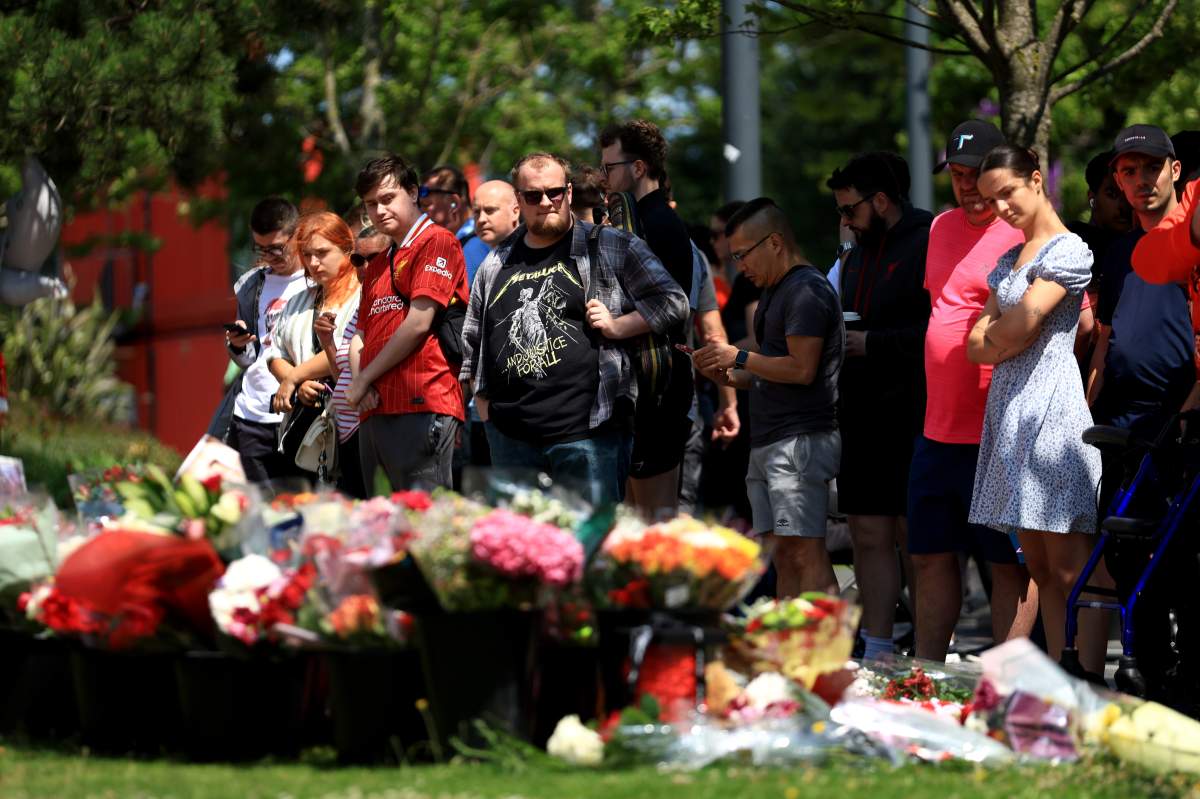 People pay their respects as tributes are laid for Diogo Jota at Anfield on July 03, 2025 in Liverpool, England. The current Liverpool player and Portugal international Jota died in a car crash in Zamora, Spain at the age of 28.