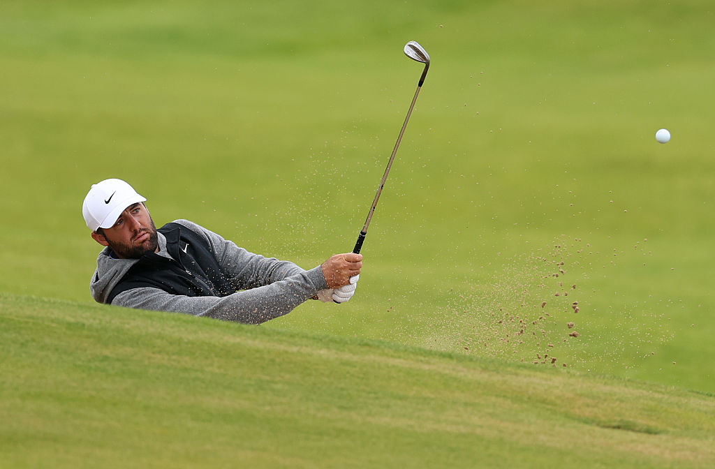 Scottie Scheffler of the United States plays a bunker shot during a practice round prior to The 153rd Open Championship at Royal Portrush Golf Club on July 15, 2025 in Portrush, Northern Ireland.
