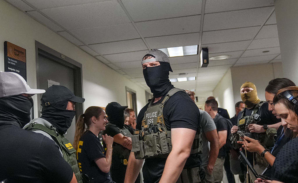 Masked federal agents who wait outside the immigration court at the Jacob K. Javits building (26 Federal Plaza) in Lower Manhattan, detain a man after he left an immigration hearing on July 23, 2025, in New York City, United States.