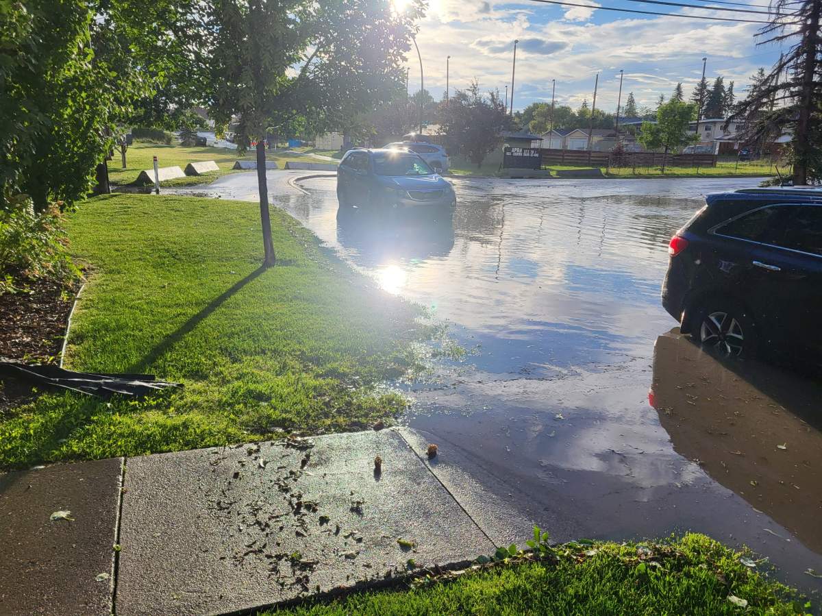 Localized flooding left water lapping at the front door of several condo buildings at the Albert Park Station complex on Sunday night.