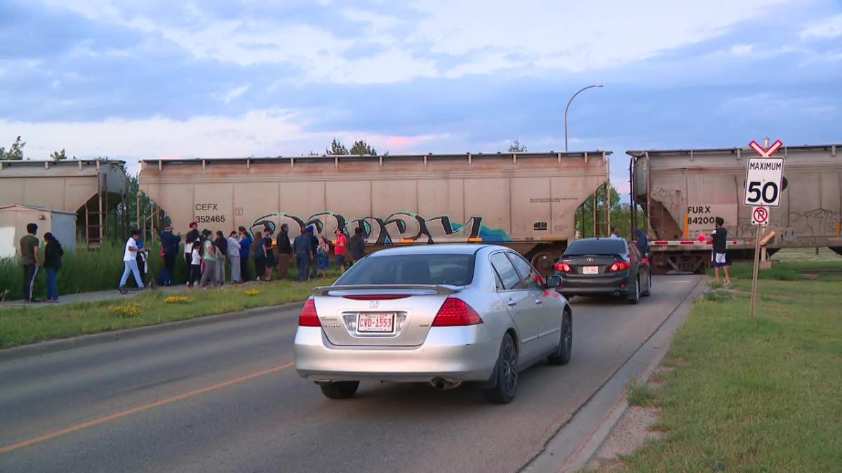 A train blocking Maple Road in southeast Edmonton on Monday, July 28, 2025.