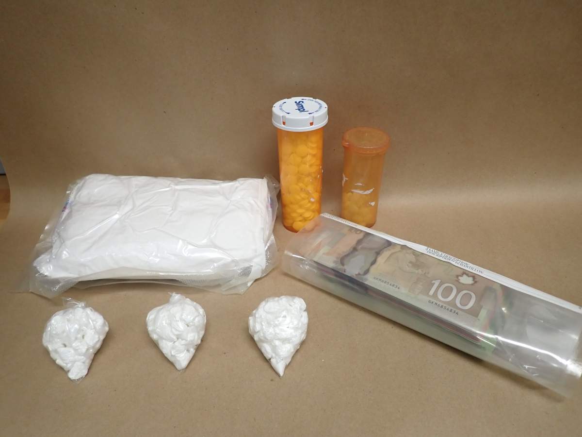 Cash, cocaine and other drugs found as part of the Alberta RCMP’s auto re-VIN theft crime investigation.
