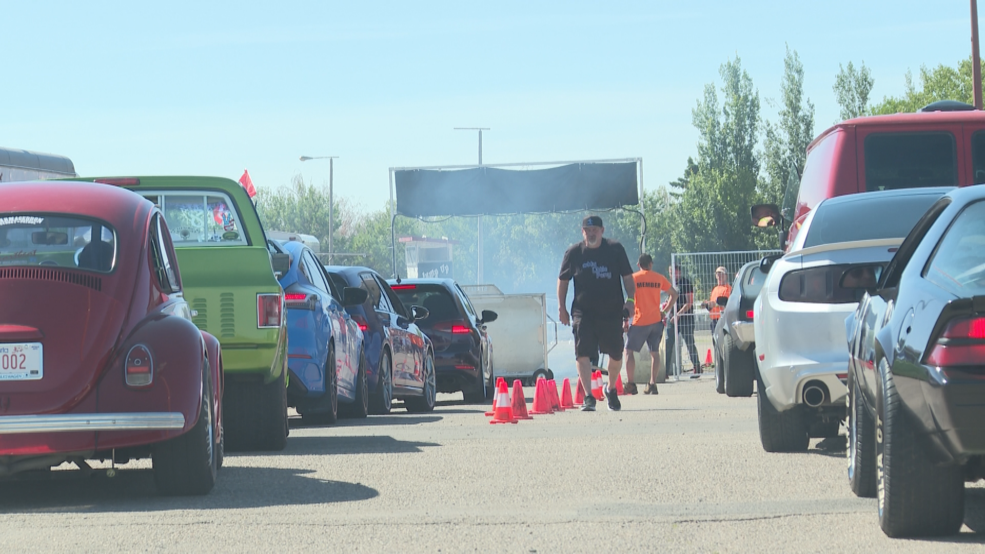 Cars lining up for their turn at the 100-foot dash.
