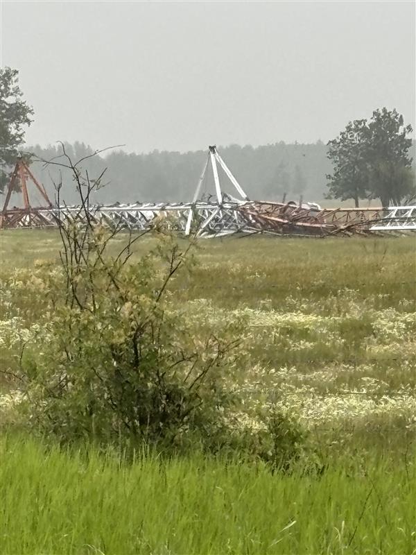 A cell tower lies on the ground in Thorhild County, Alta. on June 14, 2025. Telus says vandals destroyed the tower.