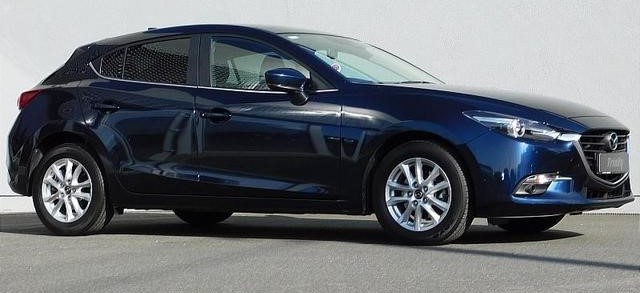 A stock picture of a blue 2017 Mazda 3 sedan. Police believe this kind of car was involved in a hit-and-run that killed an Edmonton teen in May 2024.