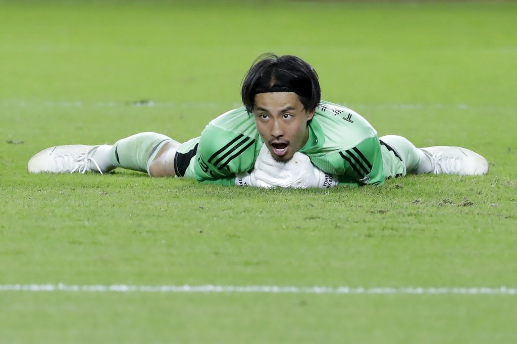 Vancouver Whitecaps goalkeeper Yohei Takaoka reacts after trapping the ball on a shot on goal by the Houston Dynamo during the second half of an MLS soccer match, Wednesday, July 16, 2025, in Houston. (AP Photo/Michael Wyke).
