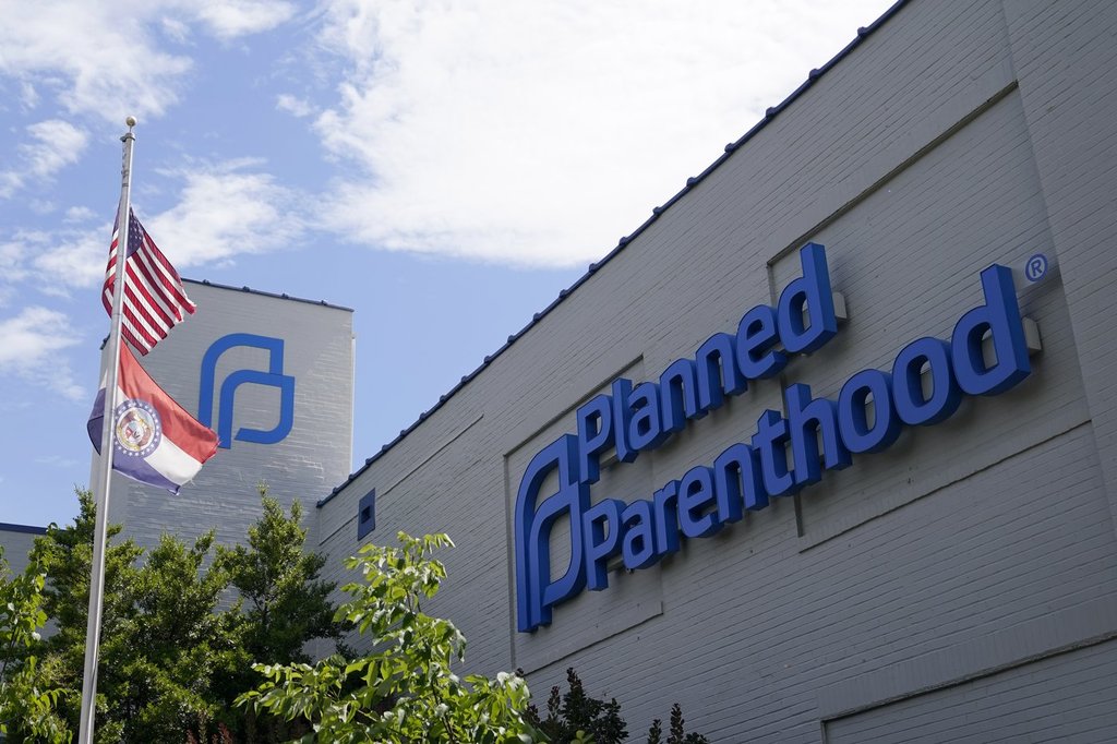 FILE - A Missouri and American flag fly outside Planned Parenthood in St. Louis, June 24, 2022. 