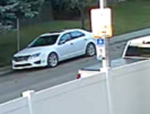 Calgary police have released photos of a white Ford Fusion whose occupants may have been witnesses to a vicious road rage assault in Calgary on July 15, 2025.