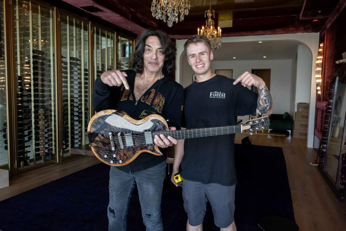 Dylan Thomas, General Manager of Black Forest Wood, also surprised Paul Stanley of KISS, with a custom made electric guitar.