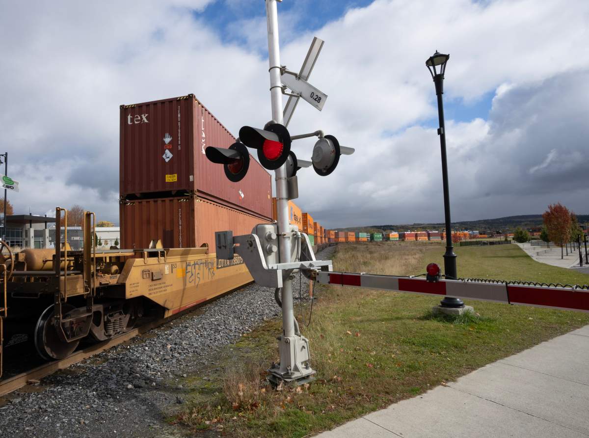 A train goes through downtown Lac Megantic, Que. on Wednesday, Oct. 16, 2024. 