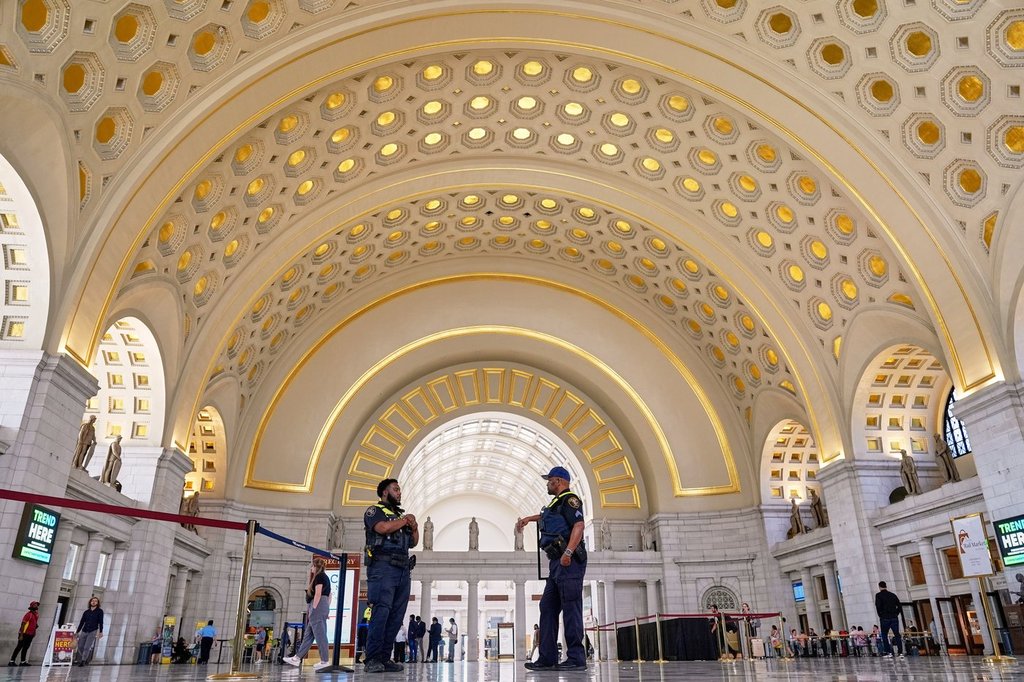 Amtrak Police officers patrol Union Station, Tuesday, Aug. 26, 2025, in Washington. (AP Photo/Mariam Zuhaib).