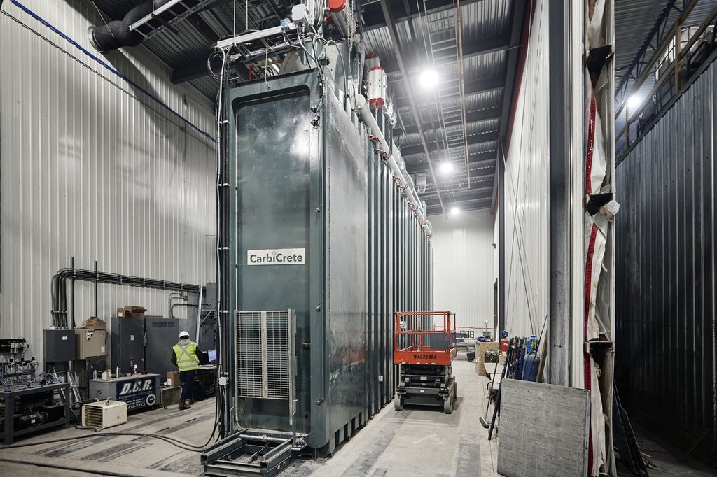 A CarbiCrete curing chamber in which CO2 is permanently mineralized into concrete during the curing process.