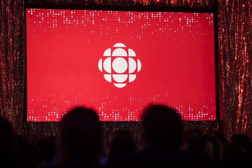 The CBC logo is projected onto a screen in Toronto on May 29, 2019.THE CANADIAN PRESS/Tijana Martin.