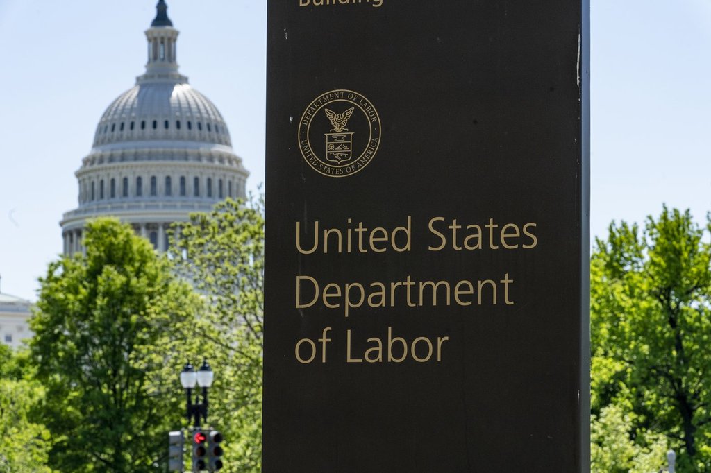 FILE - The entrance to the Labor Department is seen near the Capitol in Washington, May 7, 2020. (AP Photo/J. Scott Applewhite, File).