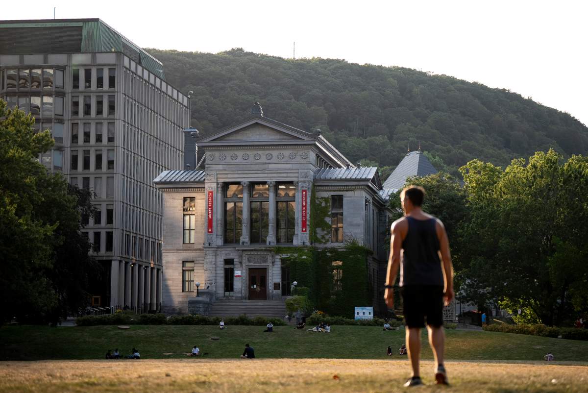 People play frisbee on the McGill University campus in Montreal on Wednesday, August 6, 2025.