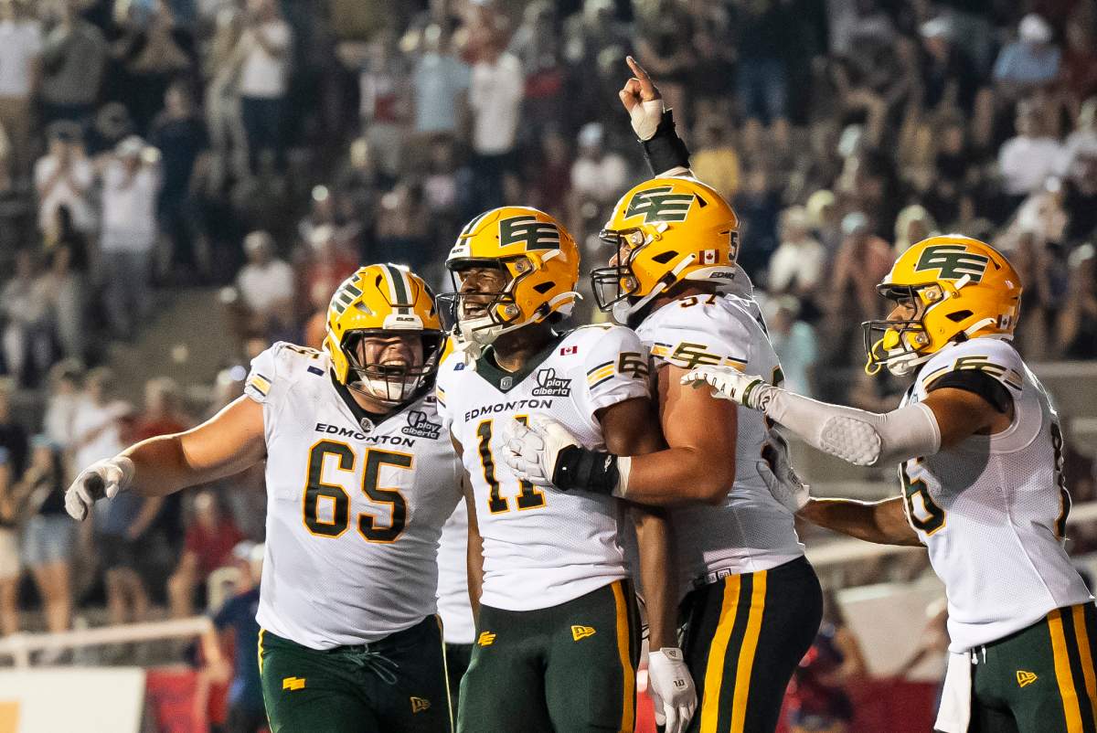 Edmonton Elks' Kaion Julien-Grant (11) celebrates with teammates after he scored during second half CFL action against the Montreal Alouettes in Montreal on Friday, Aug. 8, 2025.