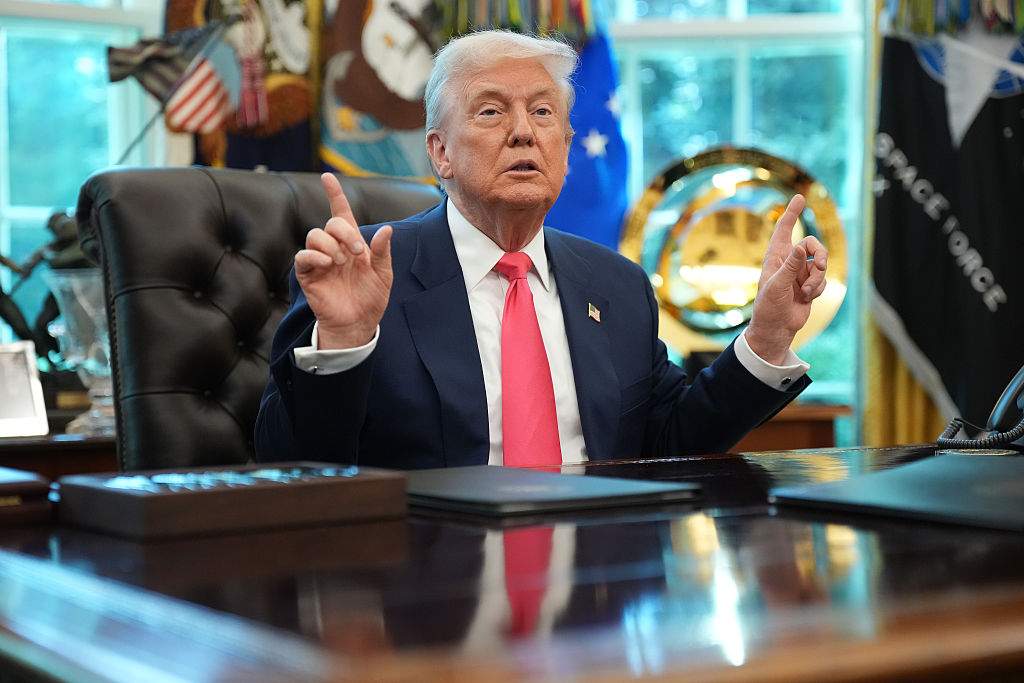 President Donald Trump answers questions from reporters in the Oval Office on August 14, 2025 in Washington, DC.