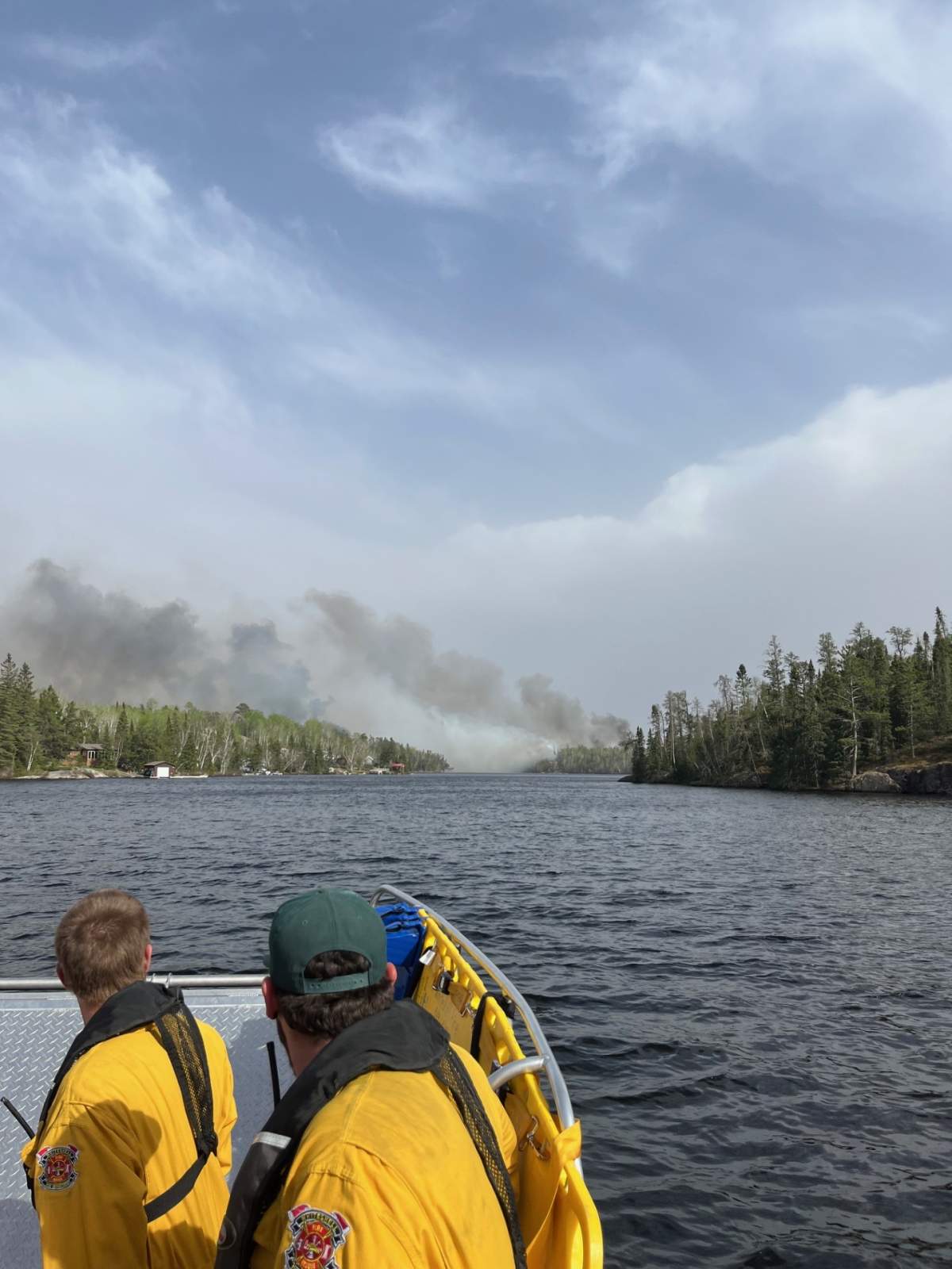 Volunteer firefighters approach the wildfire near Ingolf, Ont.