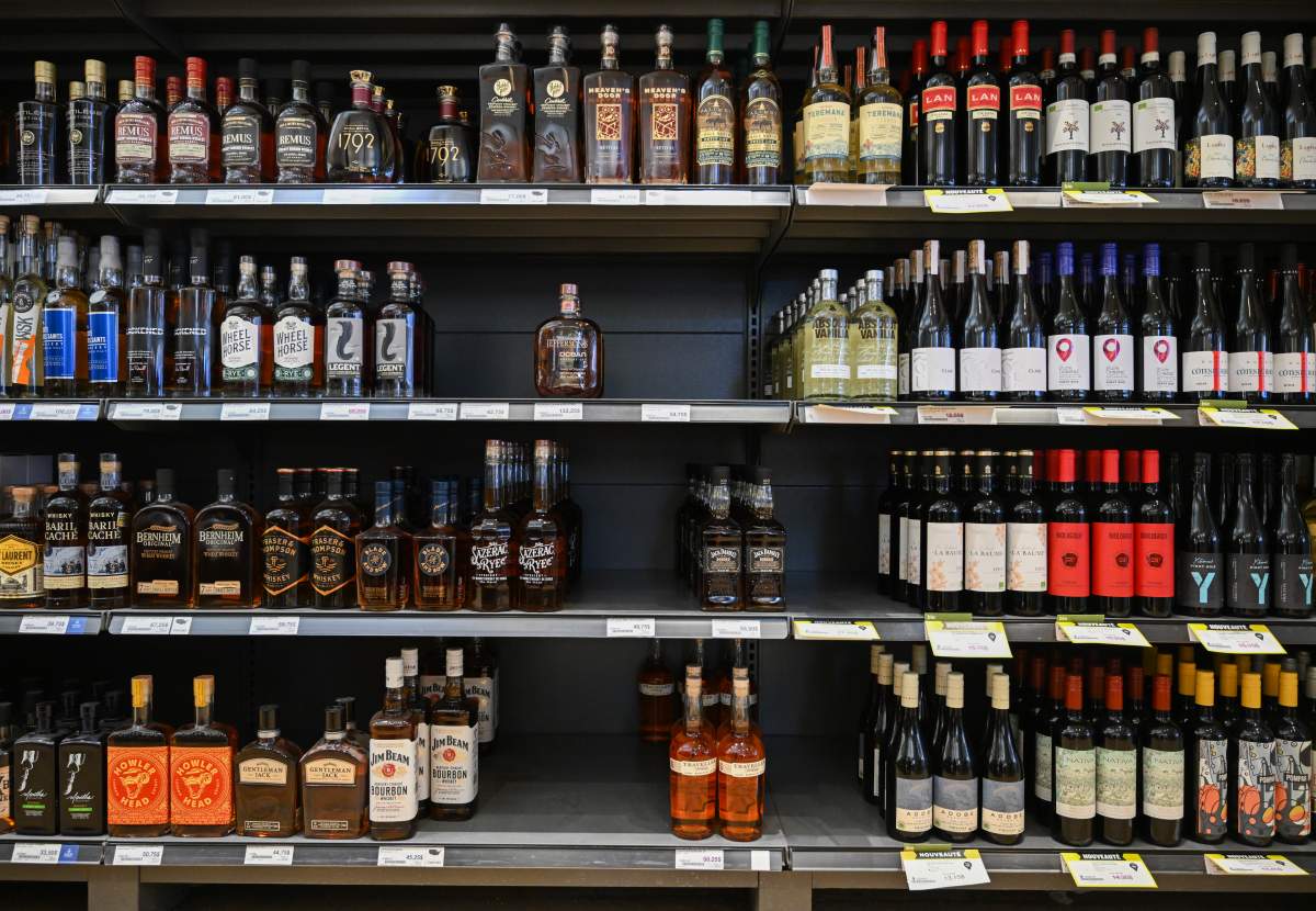 Gaps on a shelf where various US booze should be on sale is shown at a SAQ liquor store in Montreal, Friday, February 7, 2025.