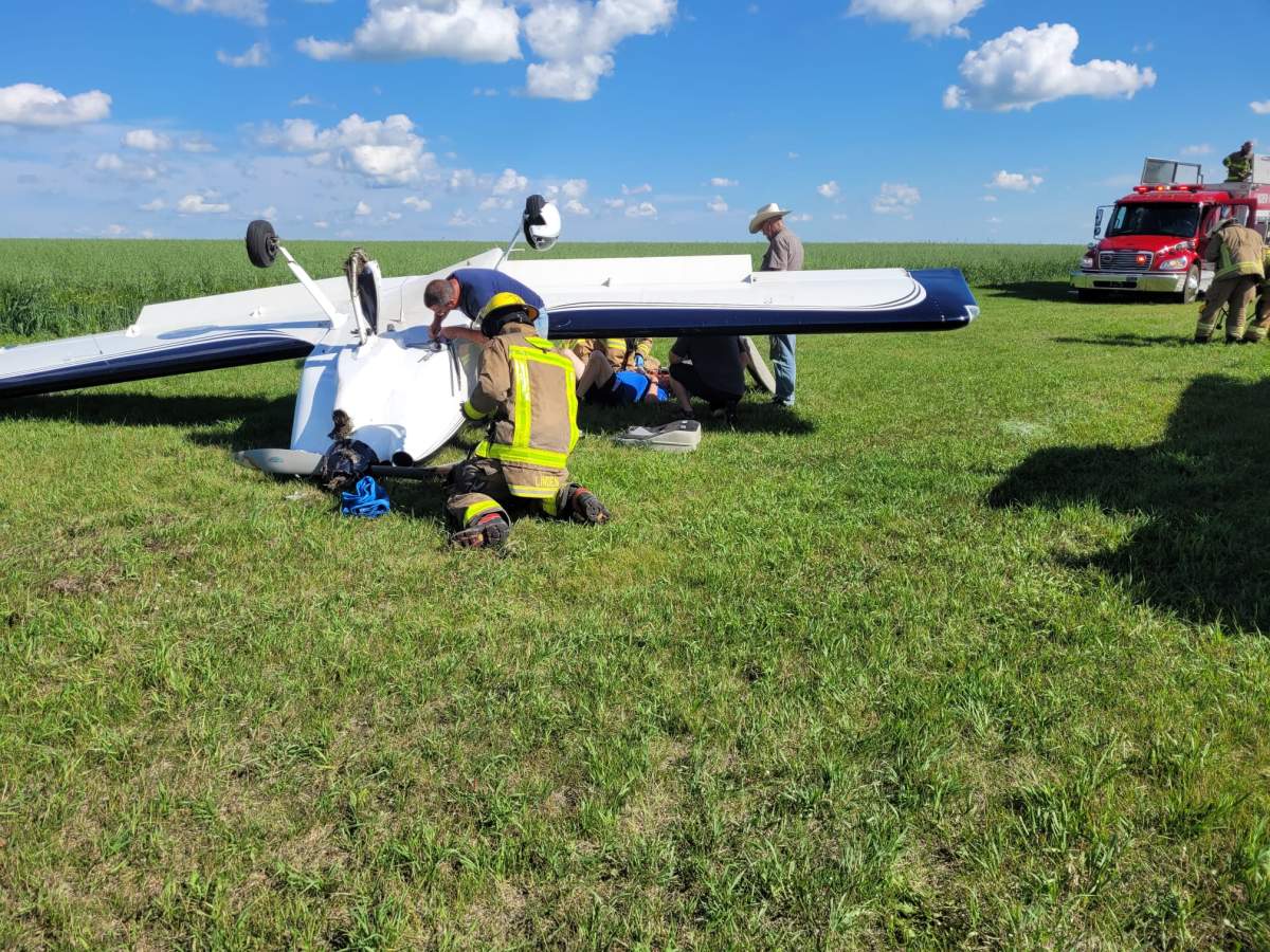A small plane is seen lying on its roof after it crashed while landing at a grass airstrip in Linden, Ab. on Tuesday, injuring two people, one of them seriously.