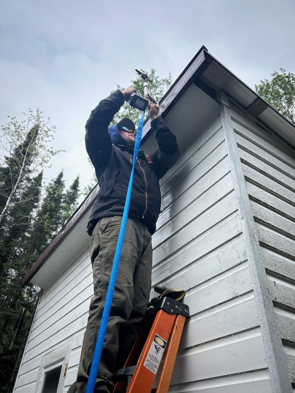 Installing sprinklers on homes and cottages as part of value protection efforts.