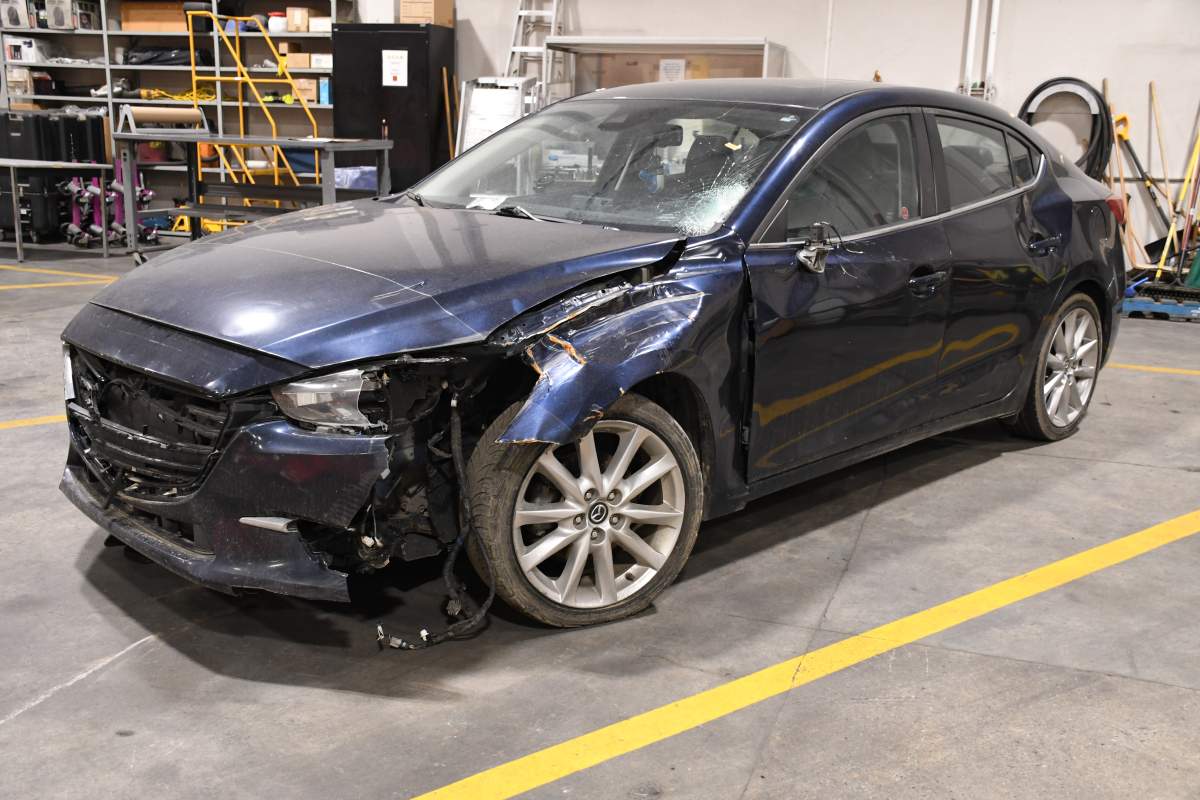 A blue, 2017 Mazda sedan involved a hit-and-run collision that left 13-year-old Adam 'AJ' Edhi dead in Mill Woods on May 29, 2024 was later found in an Edmonton autobody shop.