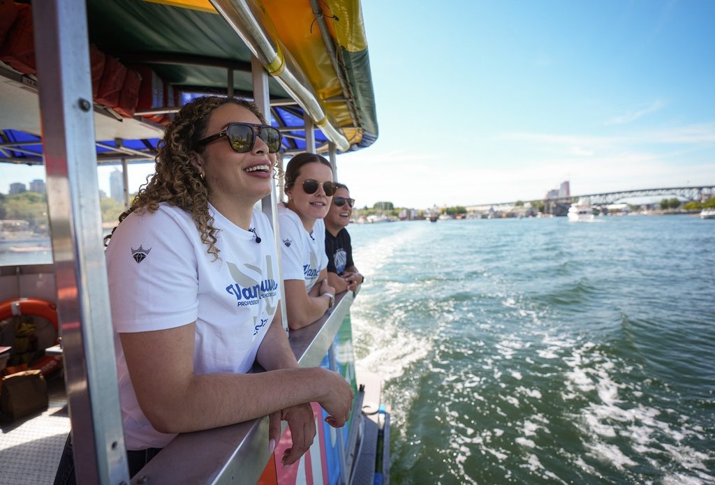 PWHL Vancouver players Sarah Nurse, from front left to back, Kristen Campbell and Jenn Gardiner tour False Creek on an Aquabus water taxi, in Vancouver, B.C., Friday, Aug. 1, 2025. The Professional Women's Hockey League added expansion teams in Vancouver and Seattle for the upcoming 2025-26 season.