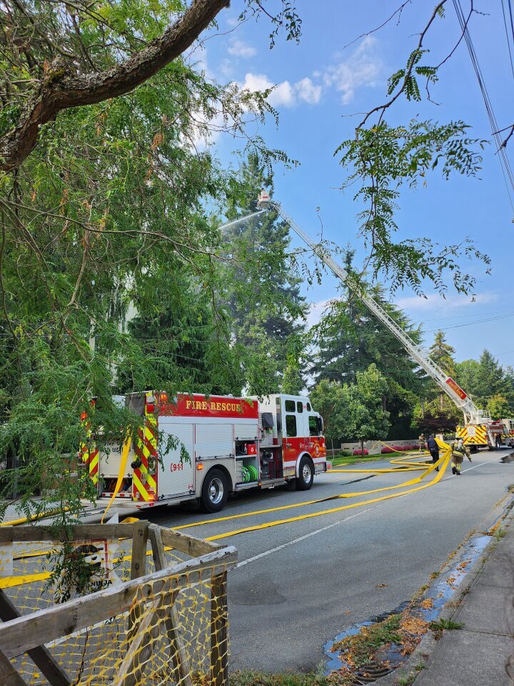 A brush fire in a densely packed Vancouver suburb prompted