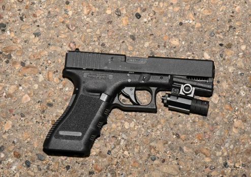 An imitation Glock 17 Austria air pistol with a flashlight attachment mounted underneath that was recovered at the scene of a fatal shooting involving police in south Edmonton on July 27, 2021.
